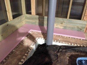 The insulation to separate the slab from the soil